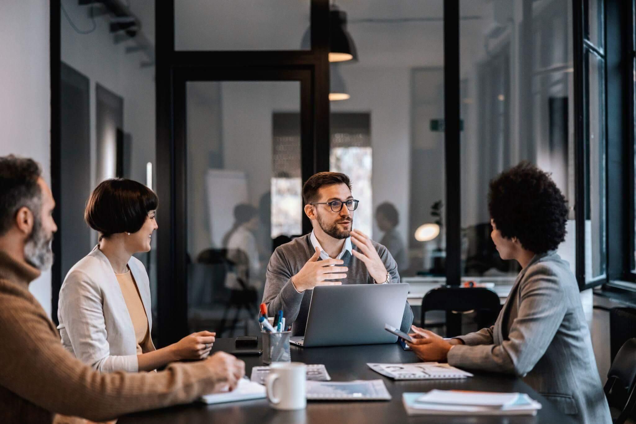 Group of people collaborating around a table
