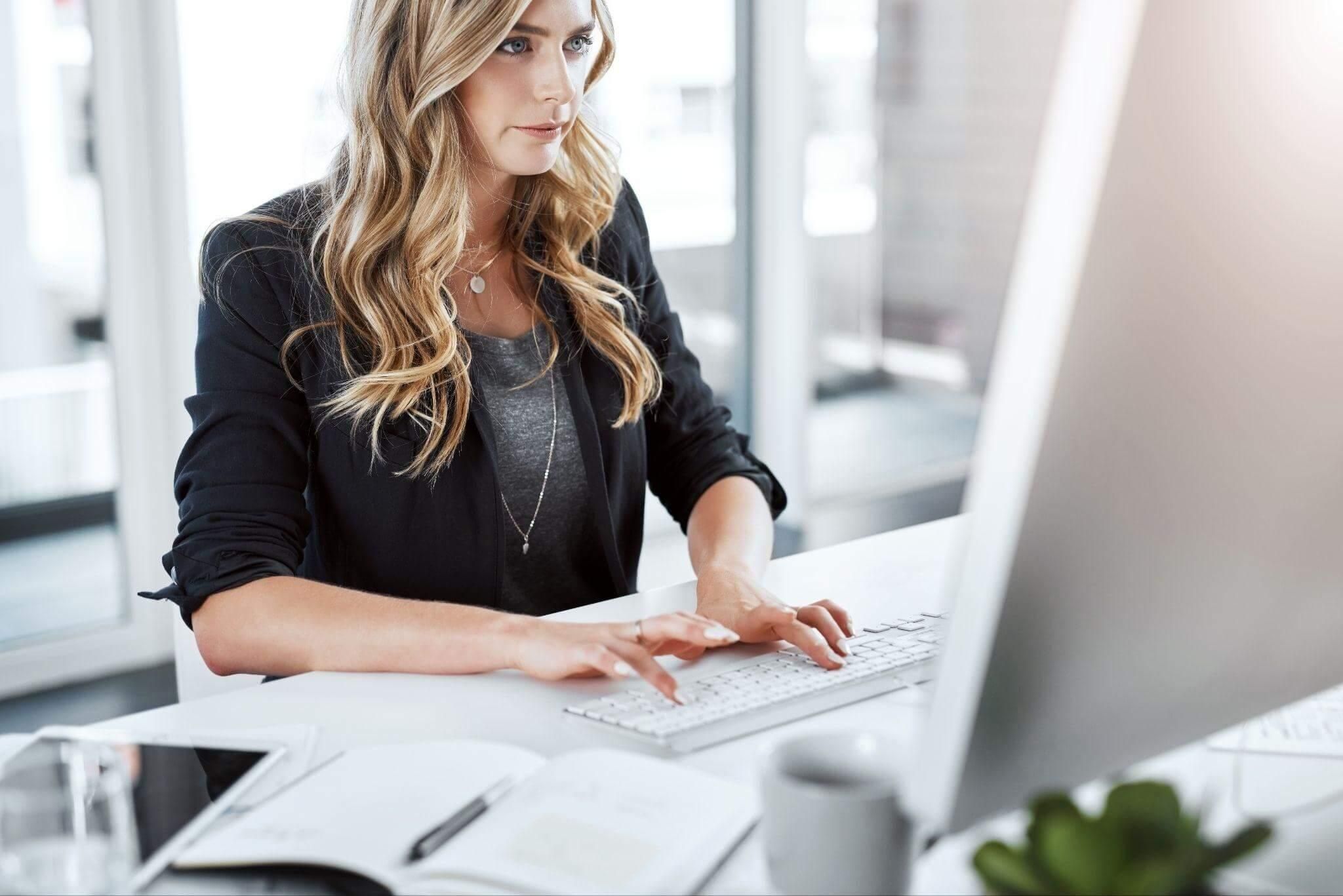 Woman using computer at desk