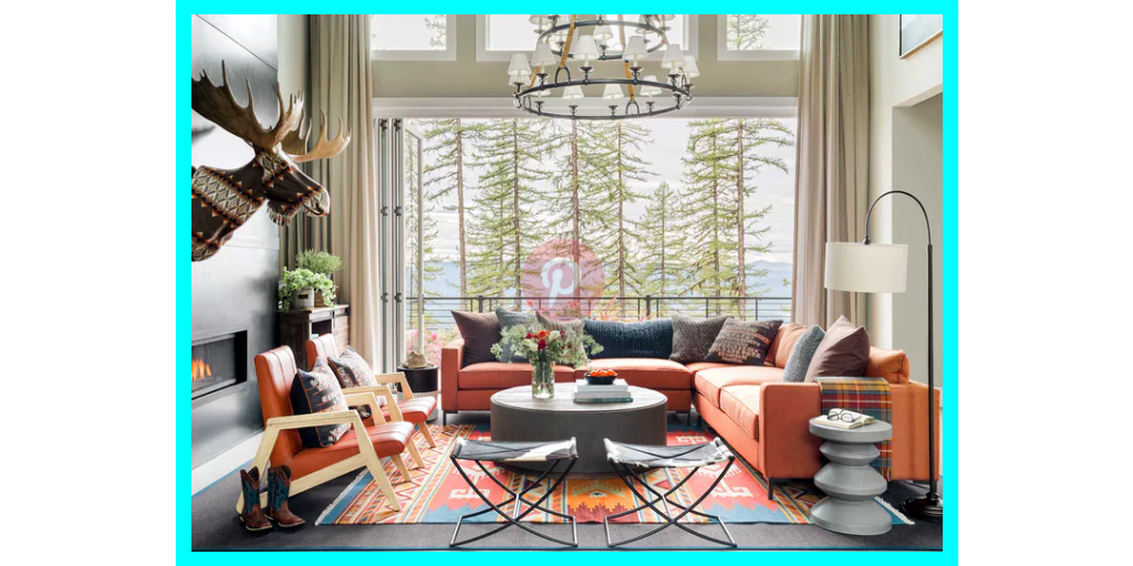 Pinterest interior design pin showing a modern living room with orange sectional sofa, patterned rug, large windows with forest view, and moose head wall decor